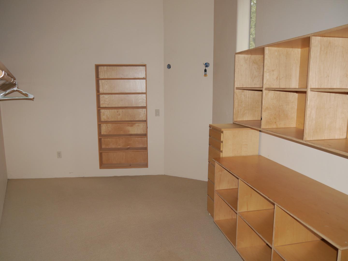 39450 Tassajara Road Carmel Valley, CA 93924 - Photo 20 of 61 a view of a room with racks on the wall and a window