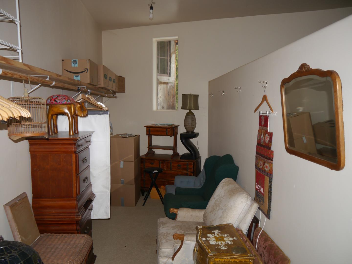39450 Tassajara Road Carmel Valley, CA 93924 - Photo 21 of 61 a living room with furniture and a painting on the wall