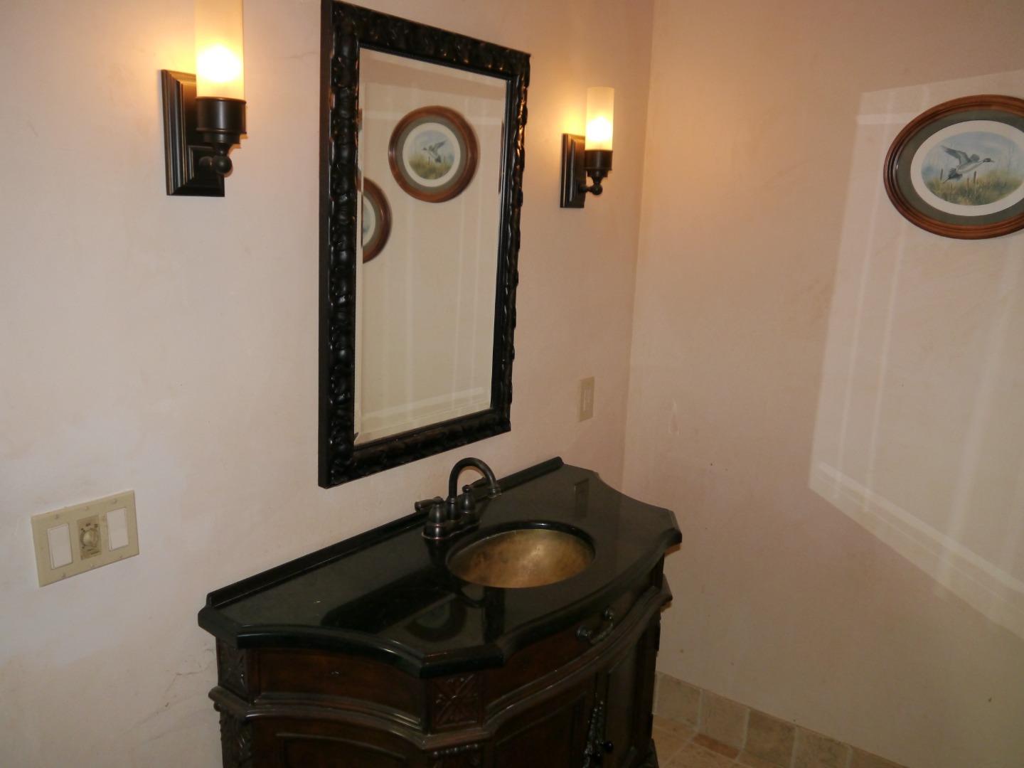 39450 Tassajara Road Carmel Valley, CA 93924 - Photo 30 of 61 a bathroom with a sink and a mirror