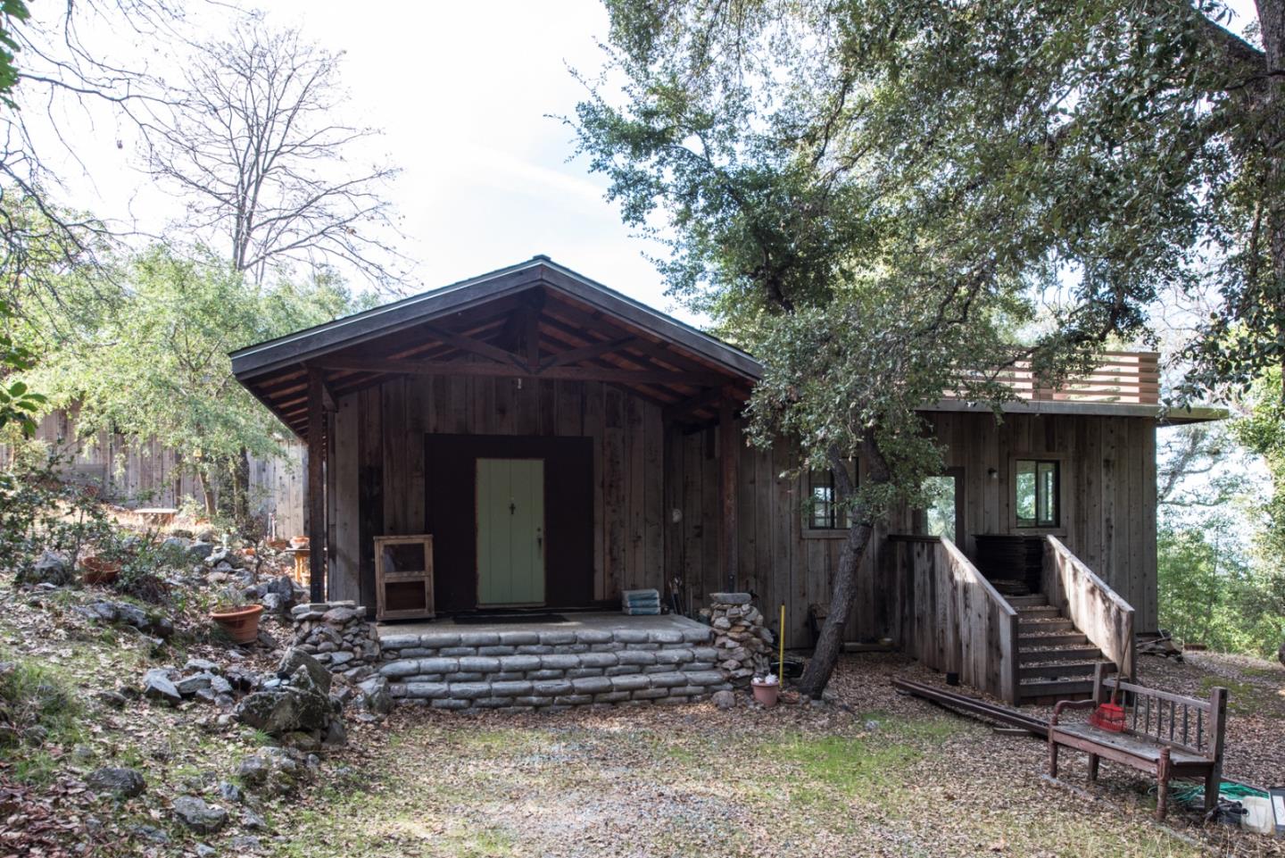 39450 Tassajara Road Carmel Valley, CA 93924 - Photo 3 of 61 a front view of a house with a yard