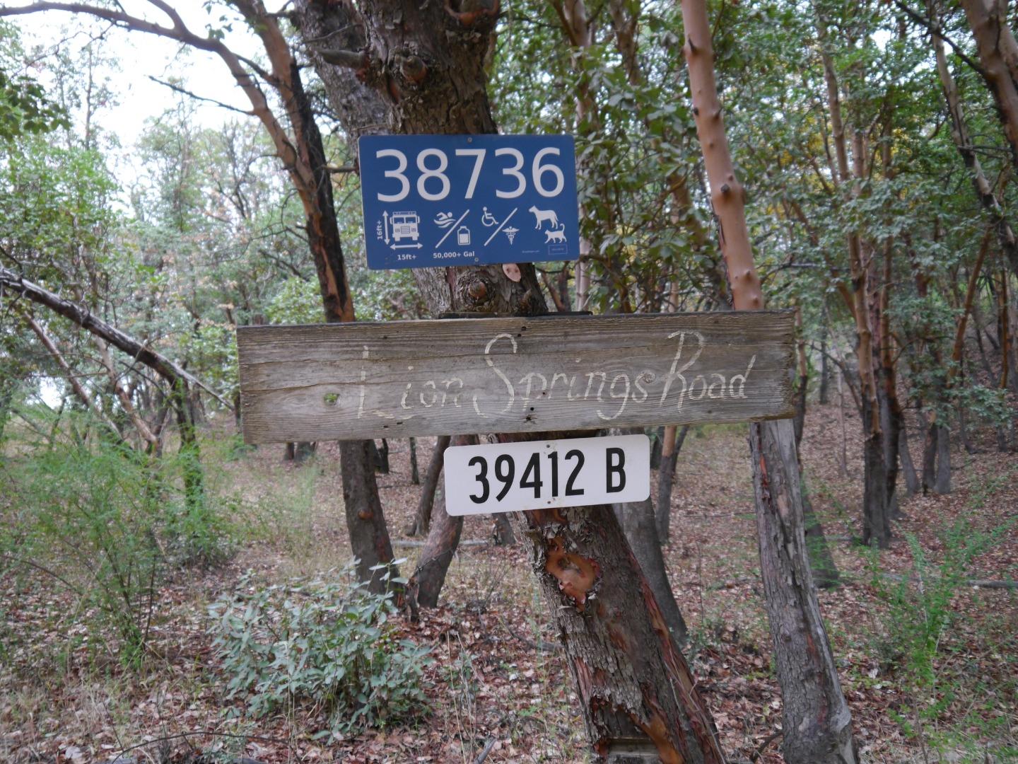 39450 Tassajara Road Carmel Valley, CA 93924 - Photo 57 of 61 a view of outdoor space with signage and flags