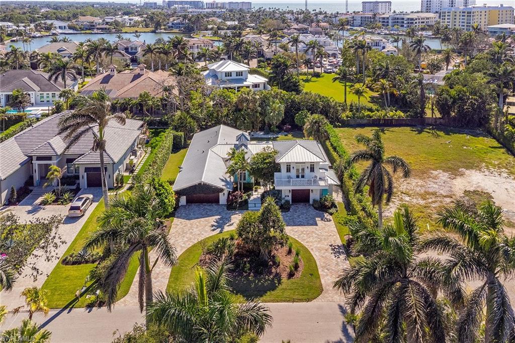 370 Rudder Road Naples, FL 34102 - Photo 1 of 26 an aerial view of residential house with outdoor space and swimming pool