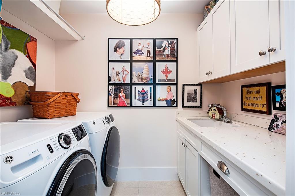 370 Rudder Road Naples, FL 34102 - Photo 16 of 26 a view of kitchen and utility room with washer and dryer