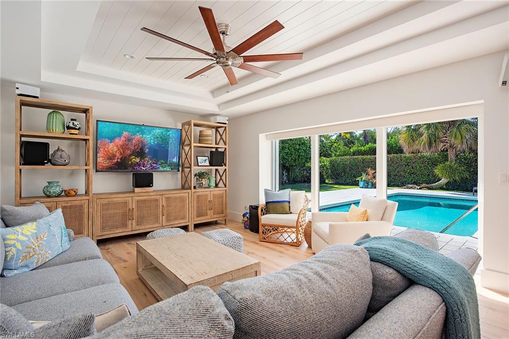 370 Rudder Road Naples, FL 34102 - Photo 6 of 26 a living room with furniture and a large window