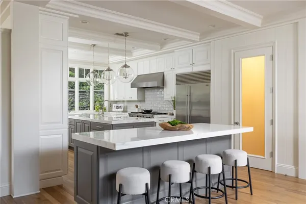 a kitchen with a sink cabinets and window