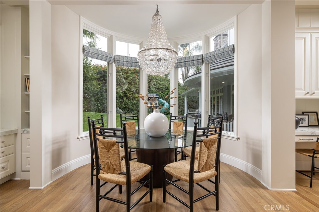 56 Royal St George Road Newport Beach, CA 92660 - Photo 17 of 49 a view of a dining room with furniture window and wooden floor