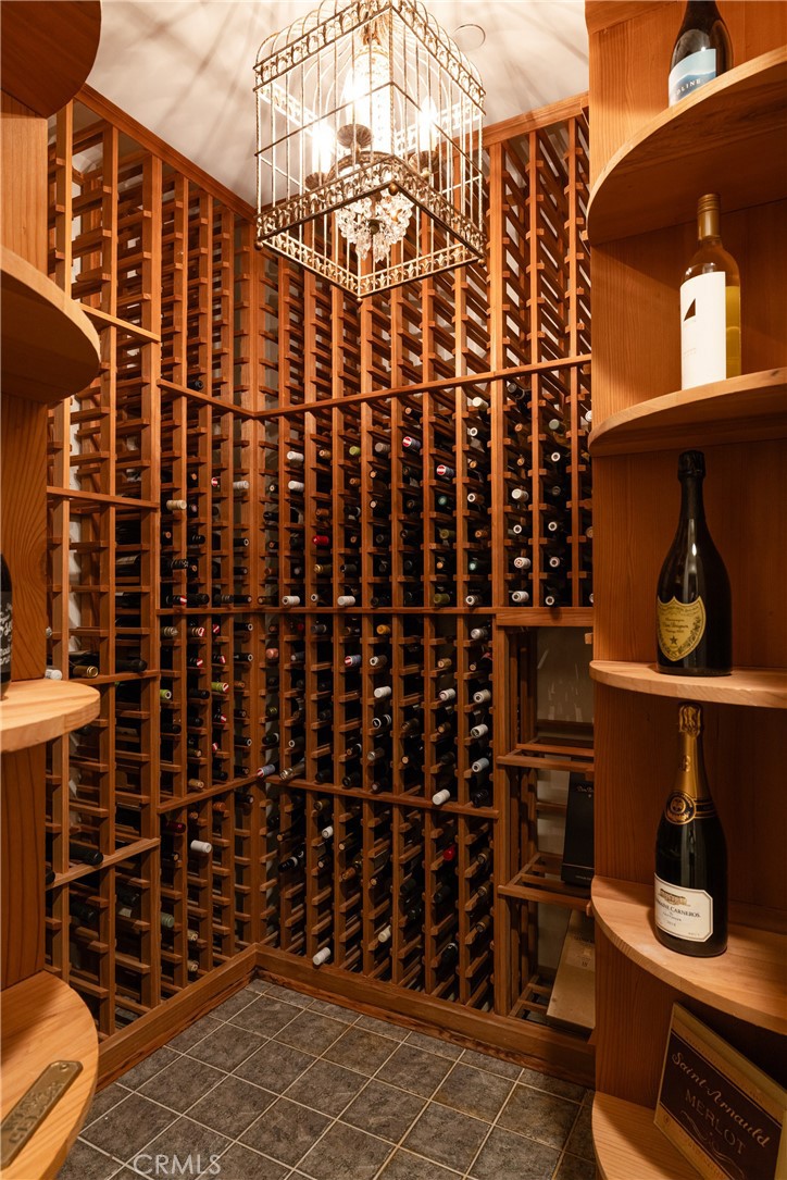 56 Royal St George Road Newport Beach, CA 92660 - Photo 19 of 49 a view of walk in closet with clothes and shoes