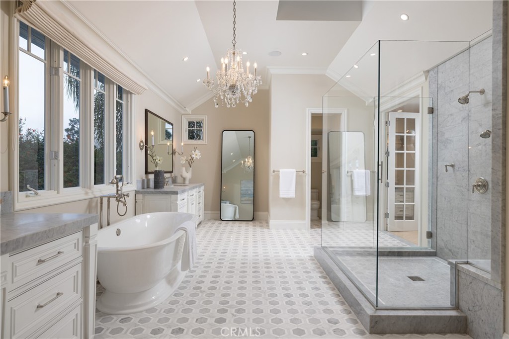 56 Royal St George Road Newport Beach, CA 92660 - Photo 23 of 49 a spacious bathroom with a tub shower and mirror