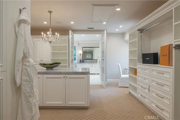 a bathroom with double vanity and a mirror