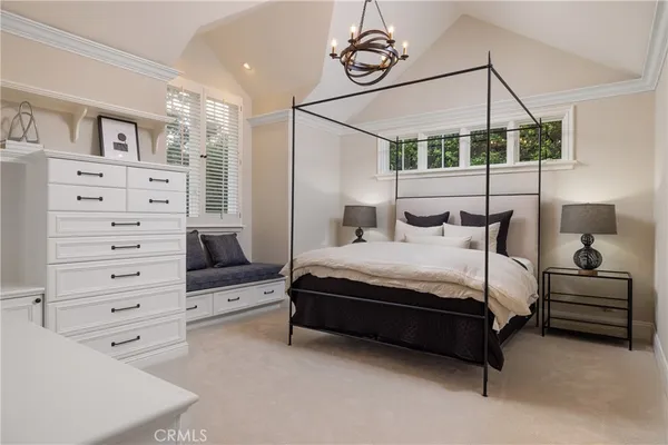 a bedroom with a bed and furniture