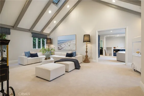 a bedroom with furniture and a large mirror