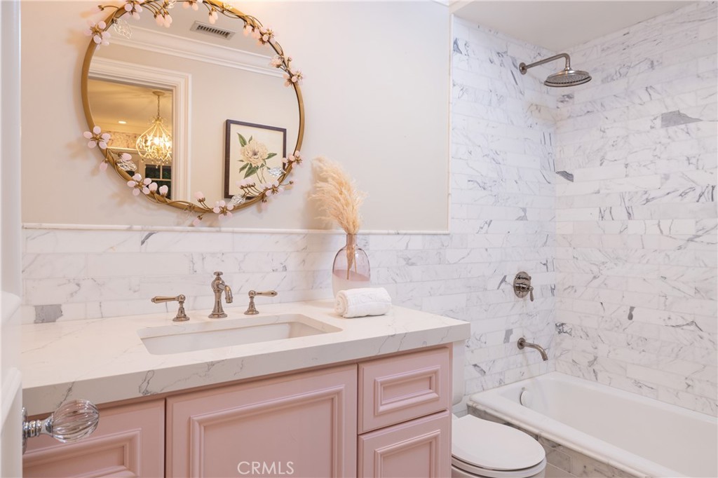 56 Royal St George Road Newport Beach, CA 92660 - Photo 34 of 49 a bathroom with a sink a toilet and bathtub