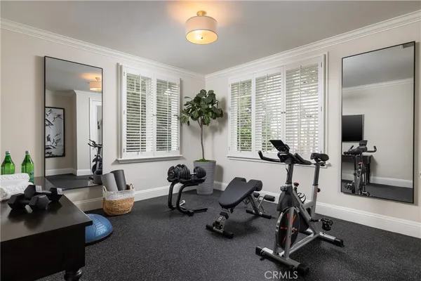a view of a livingroom with workspace and a window