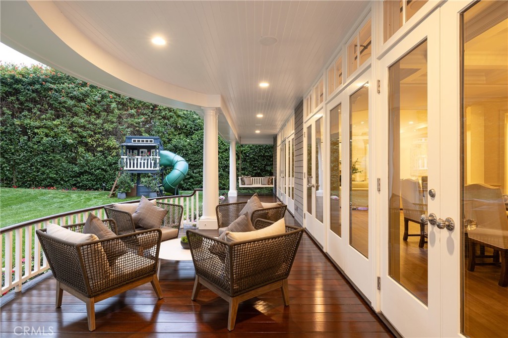 56 Royal St George Road Newport Beach, CA 92660 - Photo 41 of 49 a balcony with furniture and a garden
