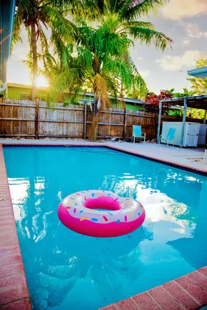 a view of a swimming pool with a yard