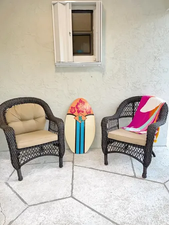a bedroom with furniture and a chair