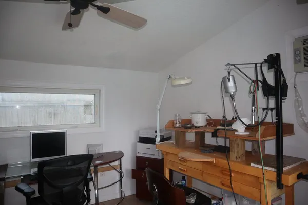 a view of a workspace with furniture
