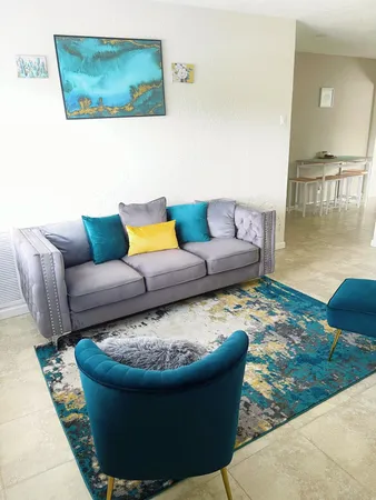 a living room with furniture and a rug