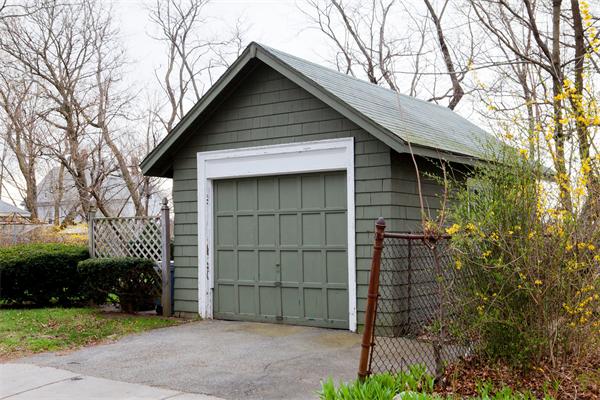 14 Clark Road Newton, MA 02465 - Photo 5 of 6 a front view of a house with a yard and garage