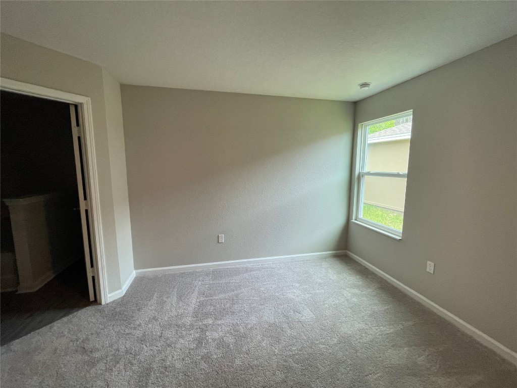 77444 Lumber Creek Boulevard Yulee, FL 32097 - Photo 12 of 24 a view of an empty room with a window