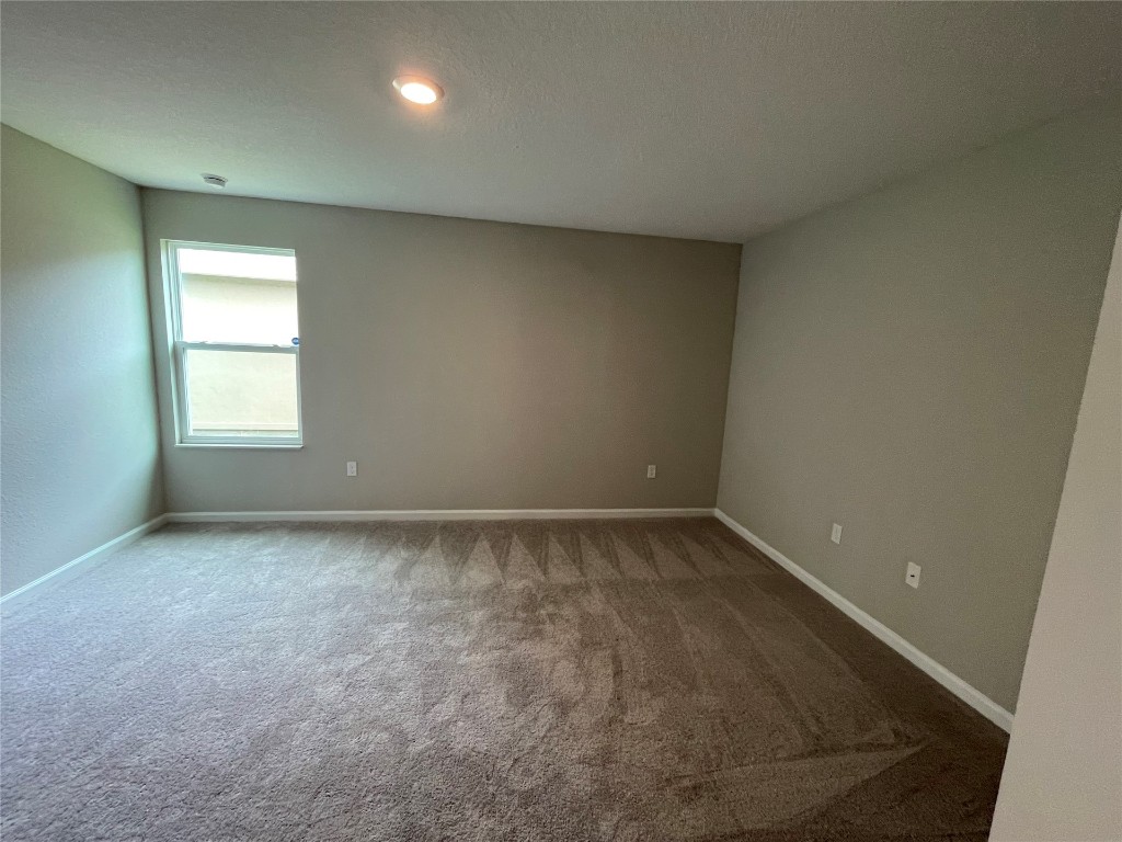 77444 Lumber Creek Boulevard Yulee, FL 32097 - Photo 13 of 24 an empty room with a window