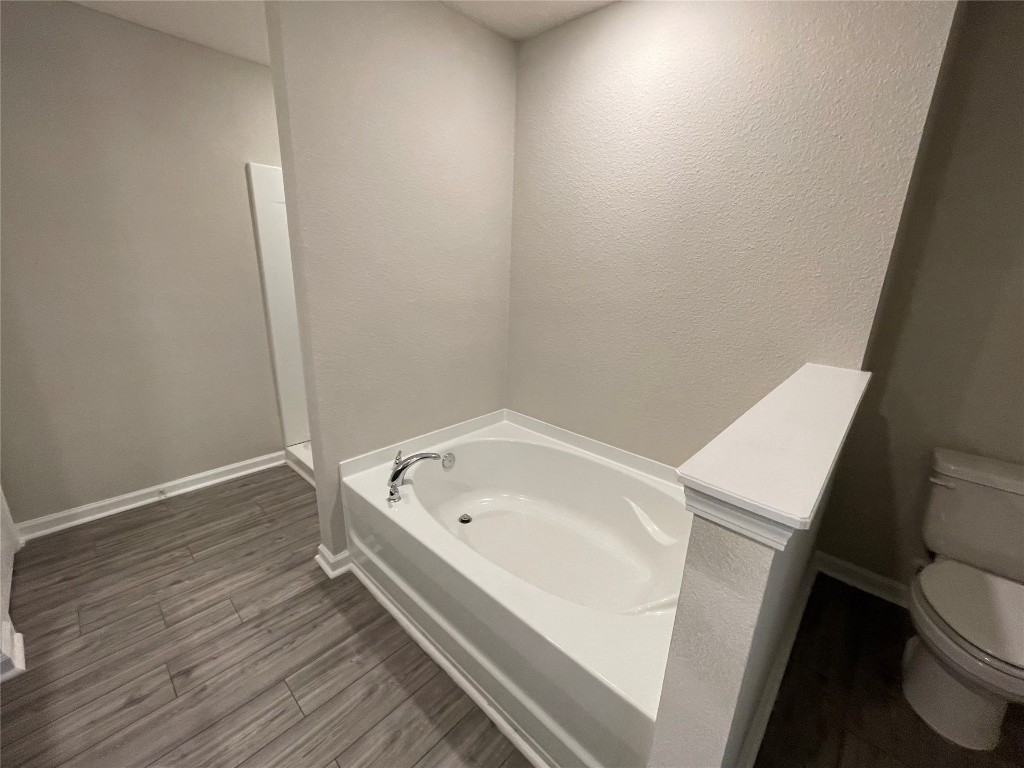 77444 Lumber Creek Boulevard Yulee, FL 32097 - Photo 16 of 24 a bathroom with a sink and toilet