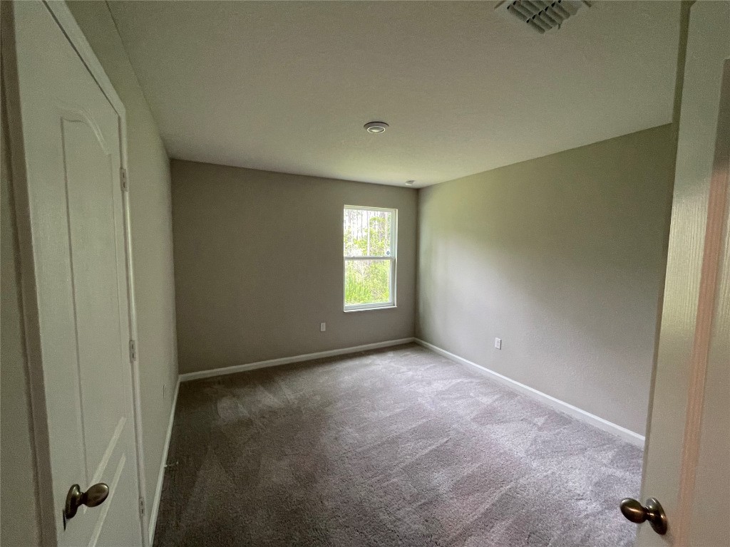 77444 Lumber Creek Boulevard Yulee, FL 32097 - Photo 18 of 24 a view of an empty room with a window