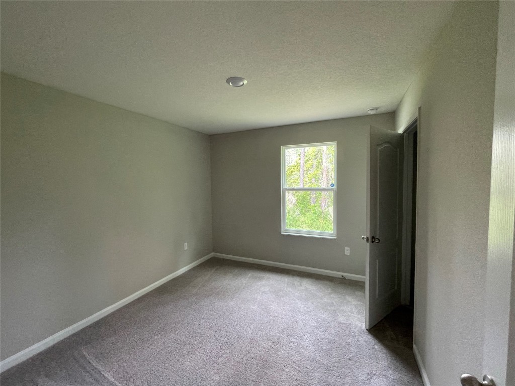77444 Lumber Creek Boulevard Yulee, FL 32097 - Photo 19 of 24 an empty room with a window