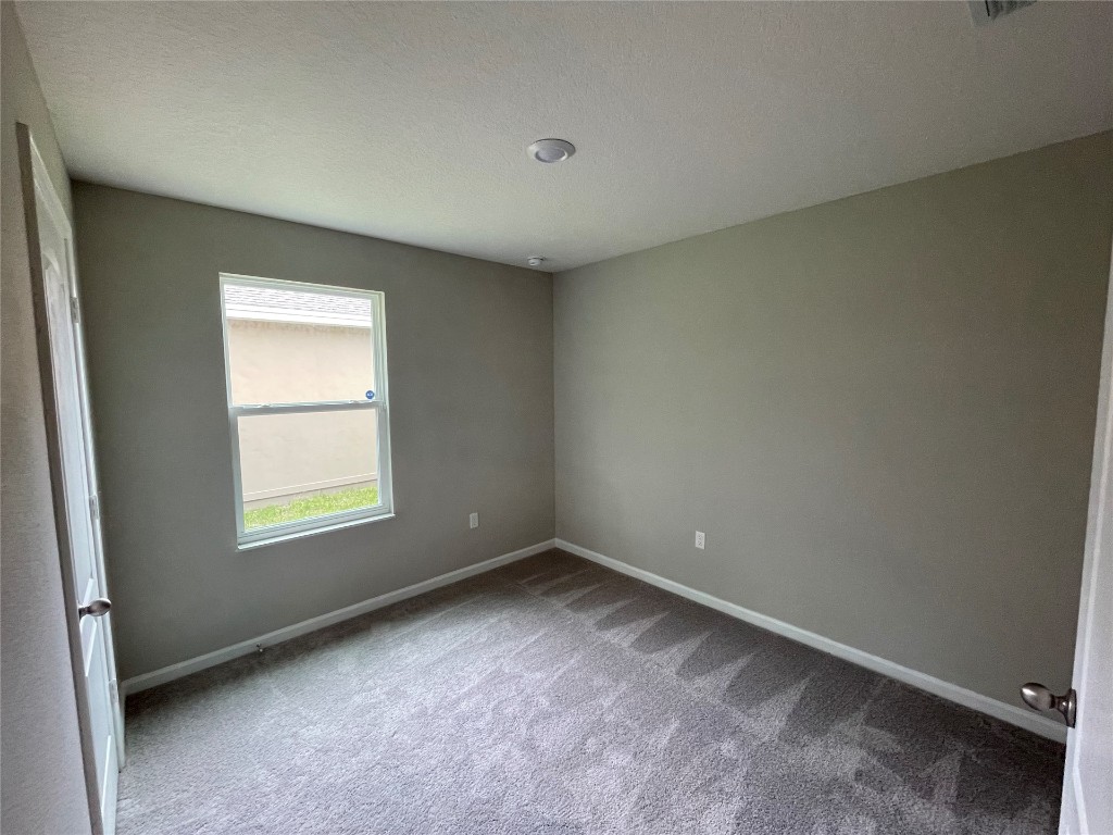 77444 Lumber Creek Boulevard Yulee, FL 32097 - Photo 20 of 24 an empty room with a window