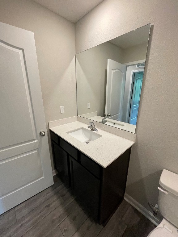 77444 Lumber Creek Boulevard Yulee, FL 32097 - Photo 21 of 24 a bathroom with a sink a mirror and a toilet