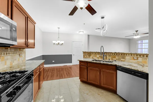 a kitchen with a sink and a stove