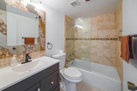 a bathroom with a sink a toilet and a bathtub