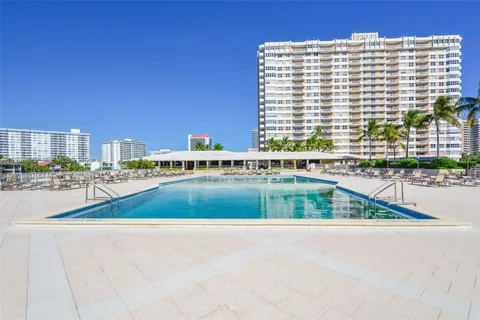 a view of swimming pool with outdoor space and seating area