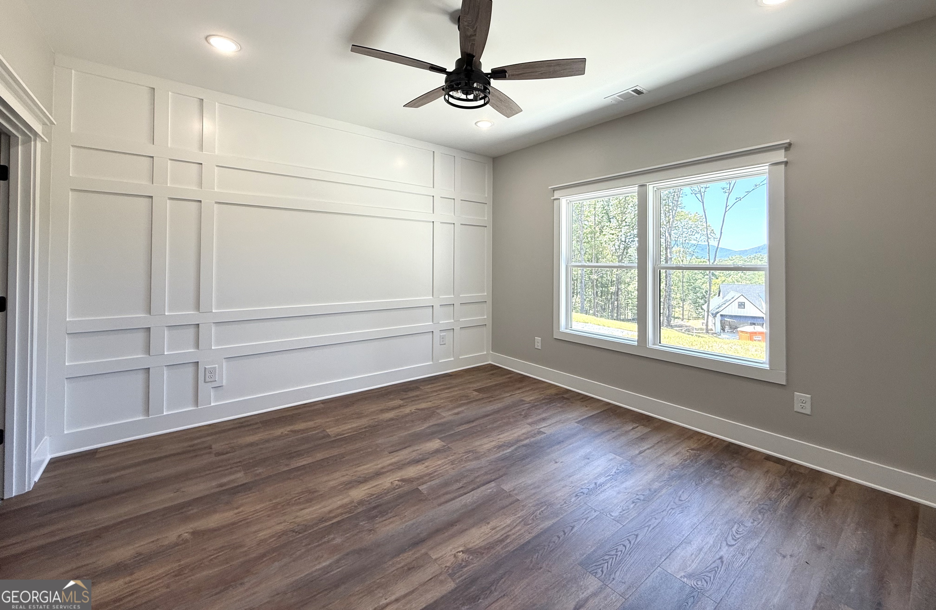 110 Sautee Ridge Road Clarkesville, GA 30523 - Photo 3 of 39 a view of an empty room with a window and wooden floor