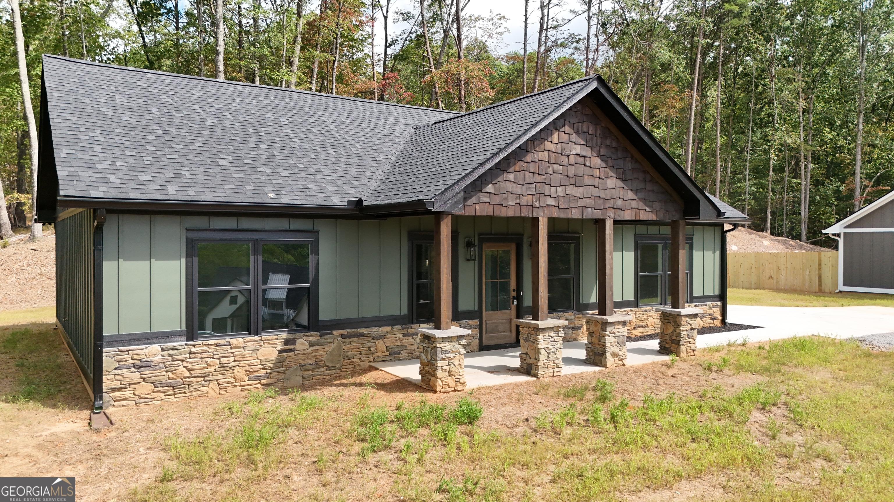 110 Sautee Ridge Road Clarkesville, GA 30523 - Photo 36 of 39 a backyard of a house with table and chairs with plants