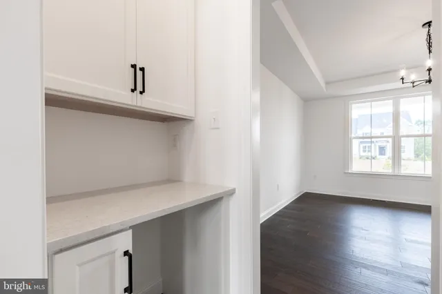 a view of cabinets and window