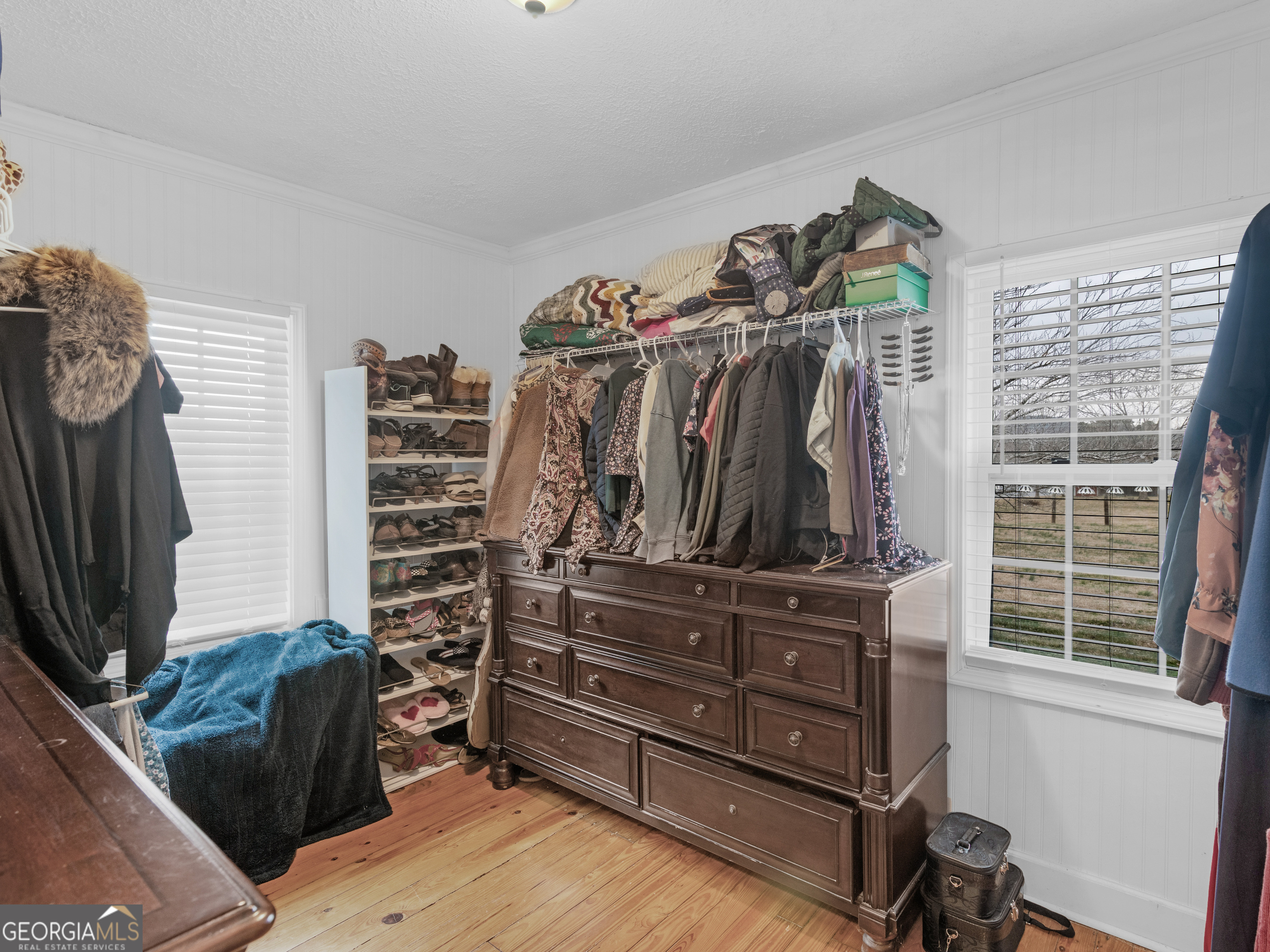 120 Ellerbee Lake Road Thomaston, GA 30286 - Photo 11 of 23 a view of walk in closet with clothes and shoes