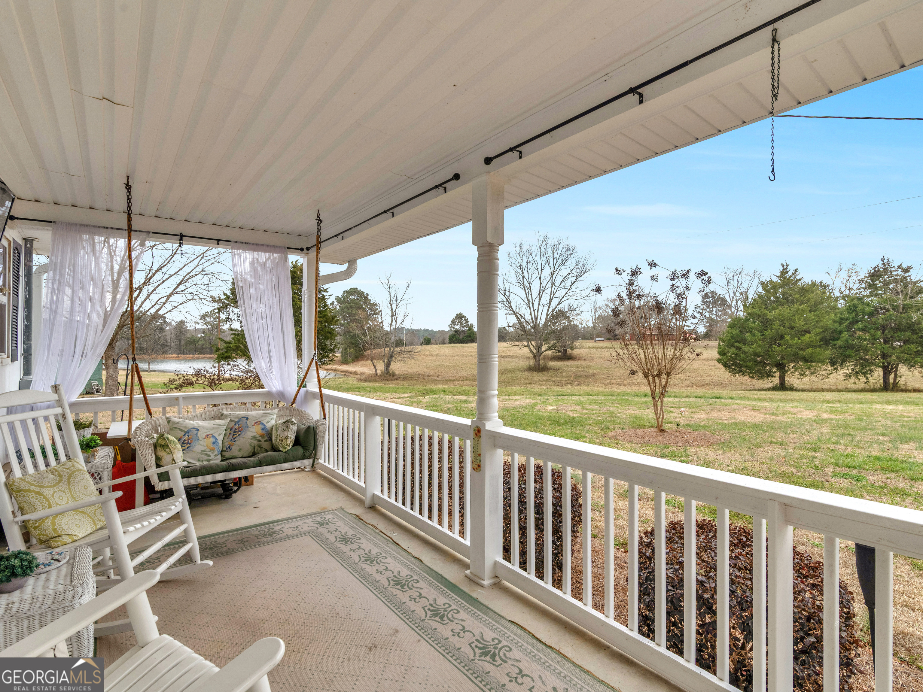 120 Ellerbee Lake Road Thomaston, GA 30286 - Photo 14 of 23 a view of a porch with furniture and a yard
