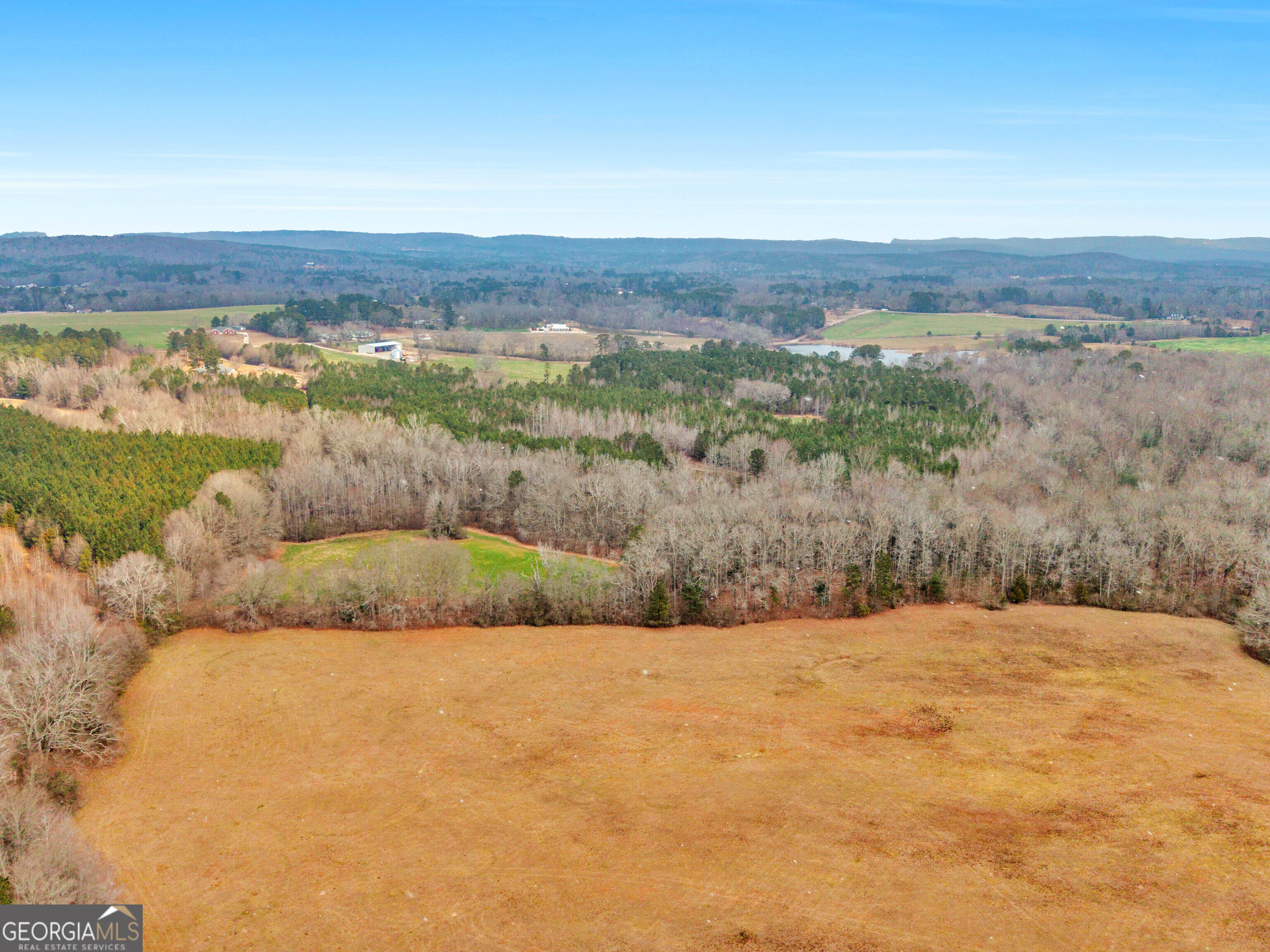 120 Ellerbee Lake Road Thomaston, GA 30286 - Photo 21 of 23 a view of lake with mountain in background