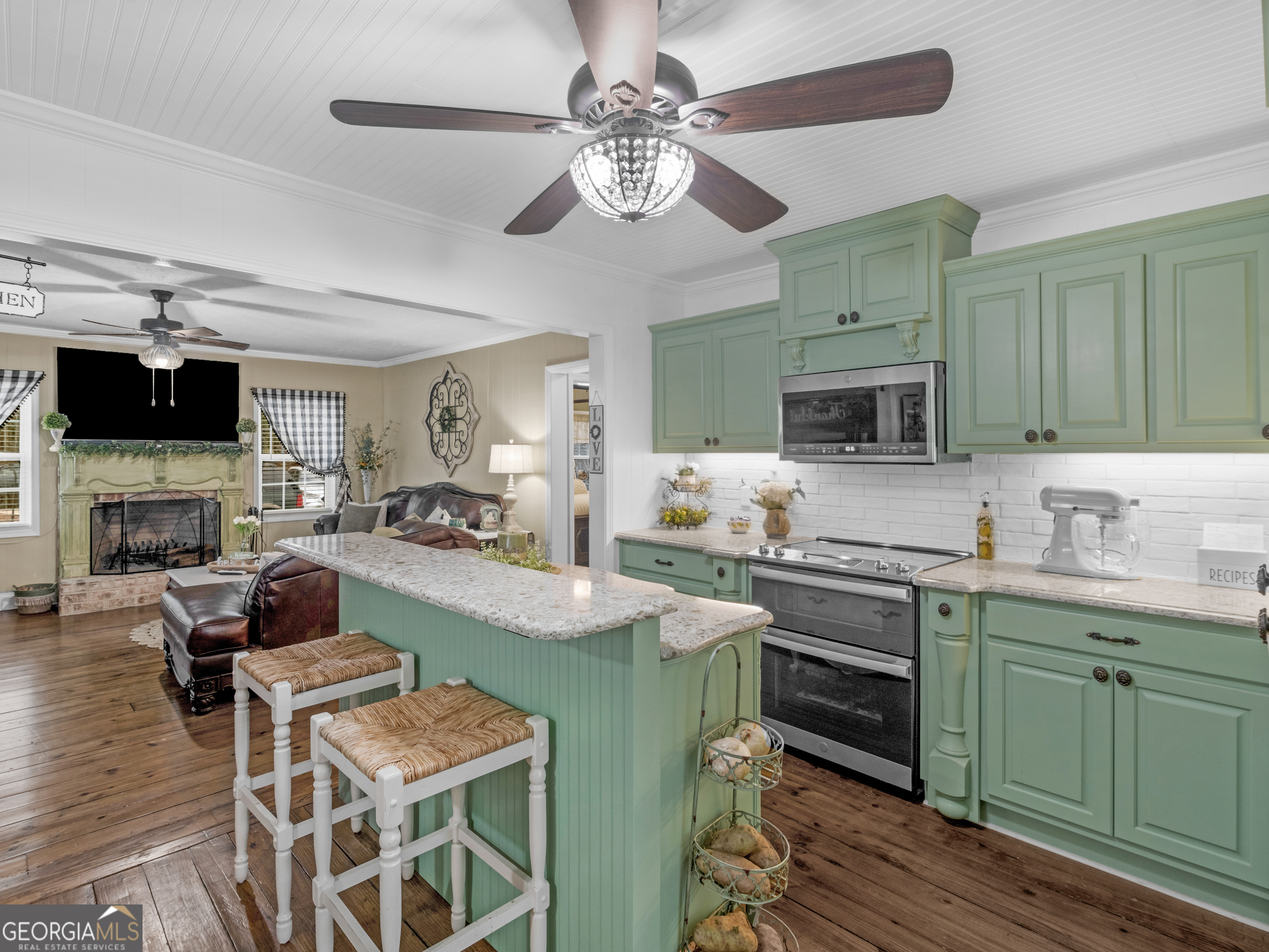 120 Ellerbee Lake Road Thomaston, GA 30286 - Photo 5 of 23 a view of kitchen with sink dining table and chairs