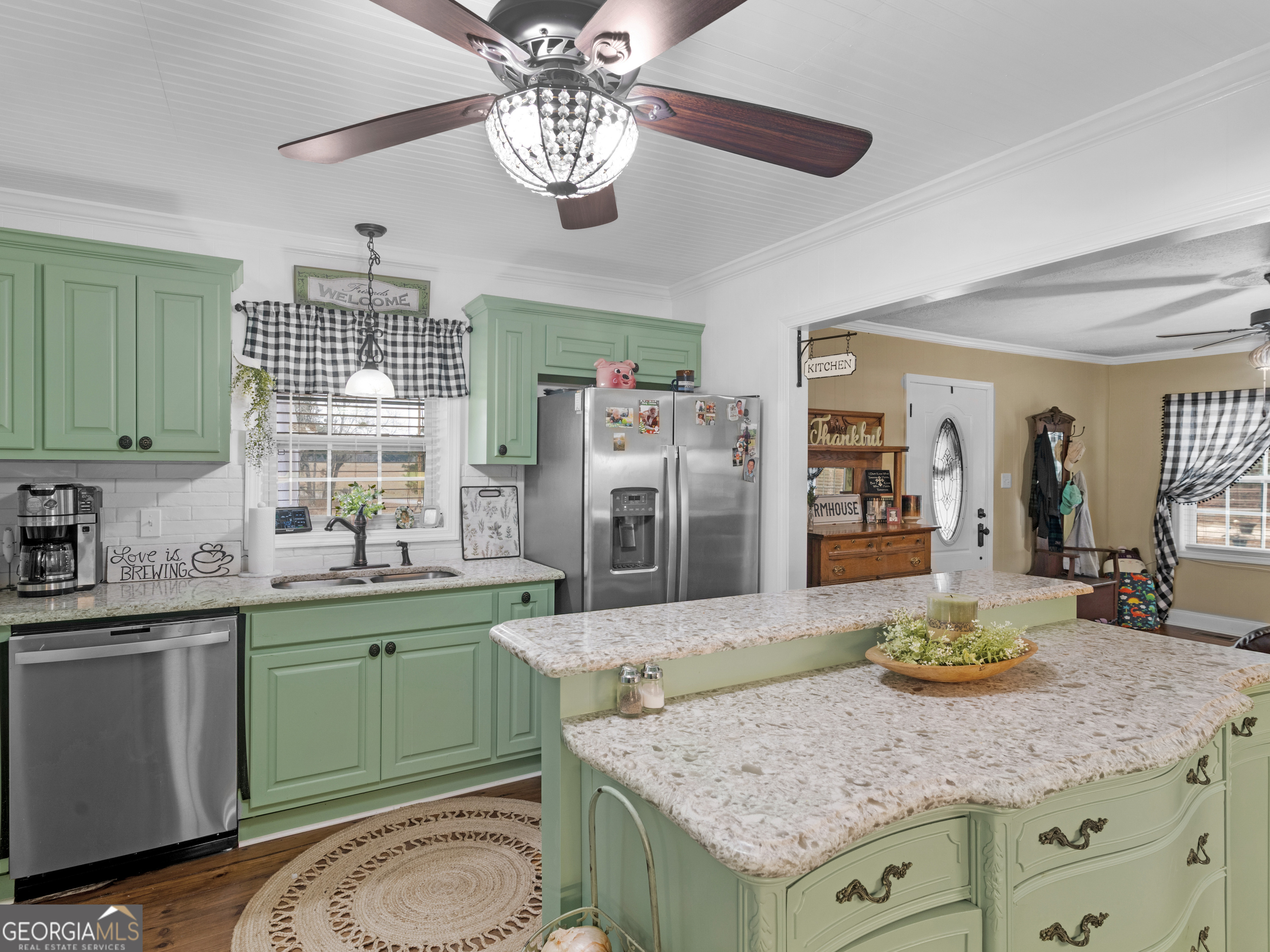 120 Ellerbee Lake Road Thomaston, GA 30286 - Photo 6 of 23 a kitchen with a sink a counter space and stainless steel appliances