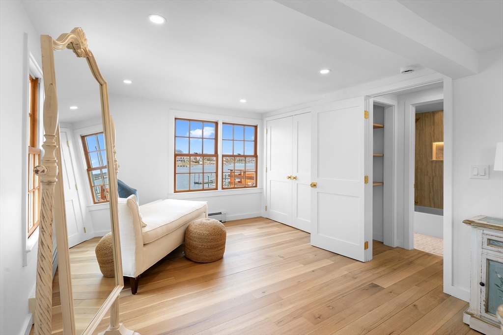 8 Pine Tree Drive Wareham, MA 02532 - Photo 16 of 35 a spacious bedroom with a bed and a wooden floor