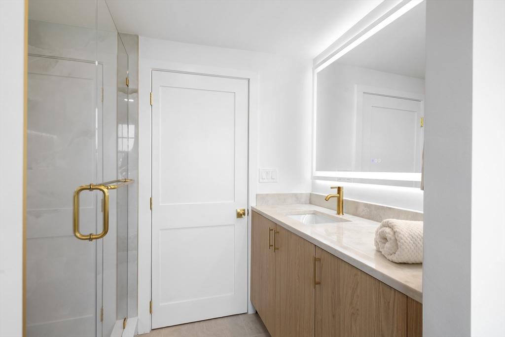 8 Pine Tree Drive Wareham, MA 02532 - Photo 22 of 35 a bathroom with a granite countertop sink and a mirror