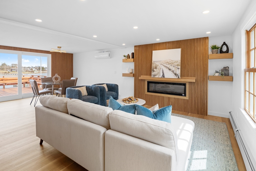 8 Pine Tree Drive Wareham, MA 02532 - Photo 8 of 35 a living room with furniture and a flat screen tv