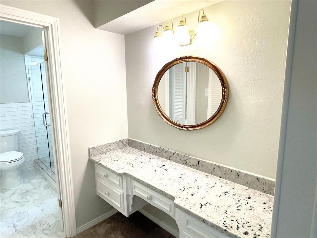 4847 Twin Post Road Dallas, TX 75244 - Photo 14 of 36 Primary Ensuite Bathroom featuring walk in shower, vanity, and toilet