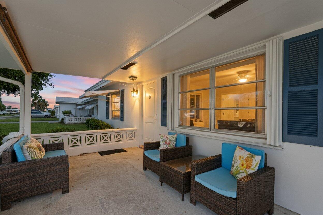 816 Southwest 18th Court Boynton Beach, FL 33426 - Photo 2 of 37 a living room with furniture and a large window