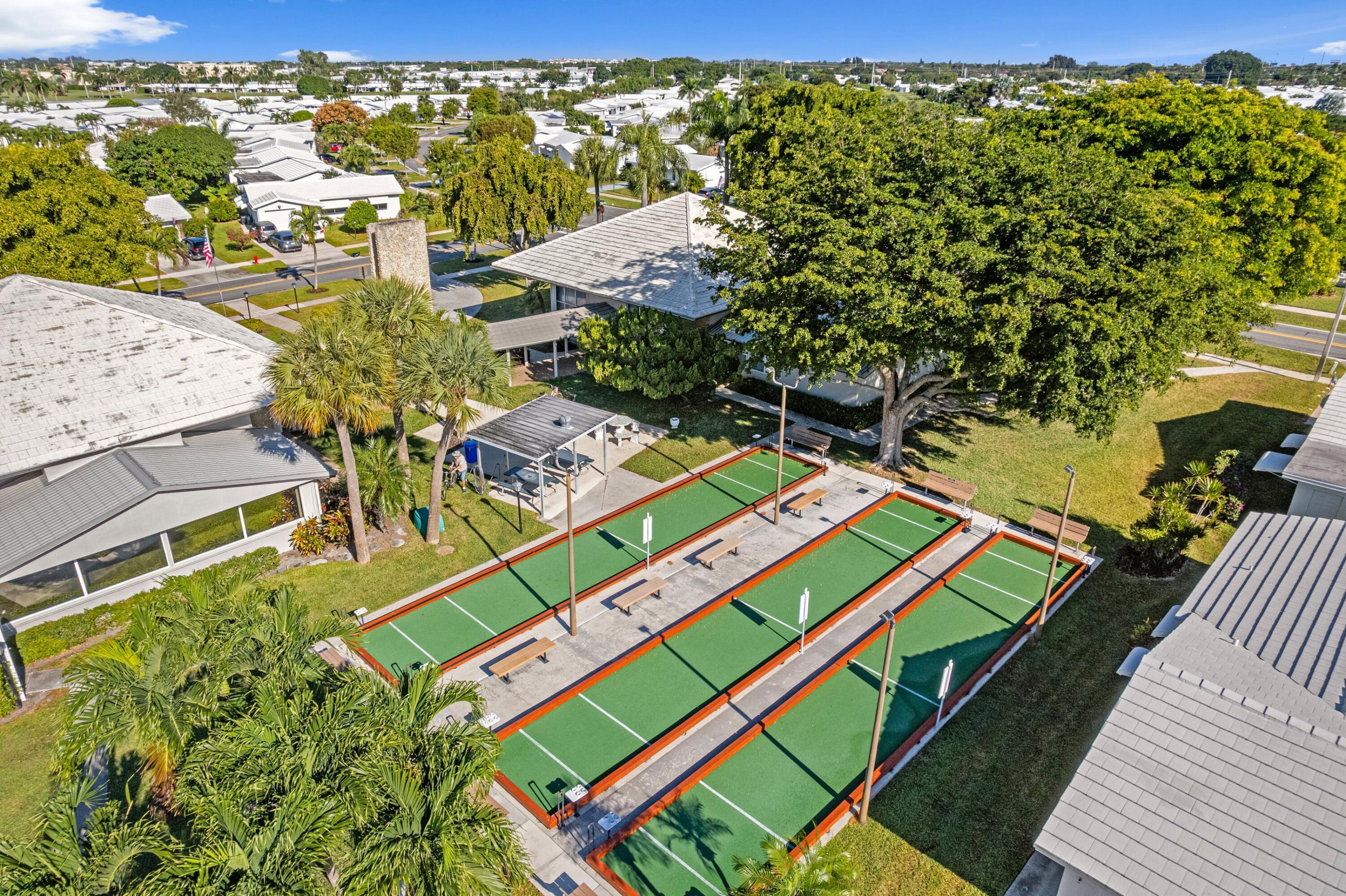 816 Southwest 18th Court Boynton Beach, FL 33426 - Photo 21 of 37 swimming pool with outdoor seating and yard