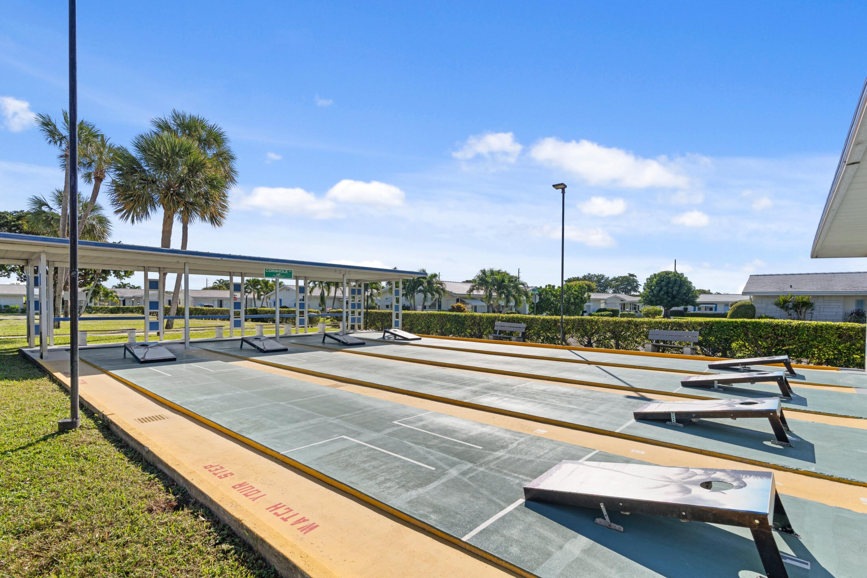 816 Southwest 18th Court Boynton Beach, FL 33426 - Photo 22 of 37 a view of swimming pool with a lounge chairs