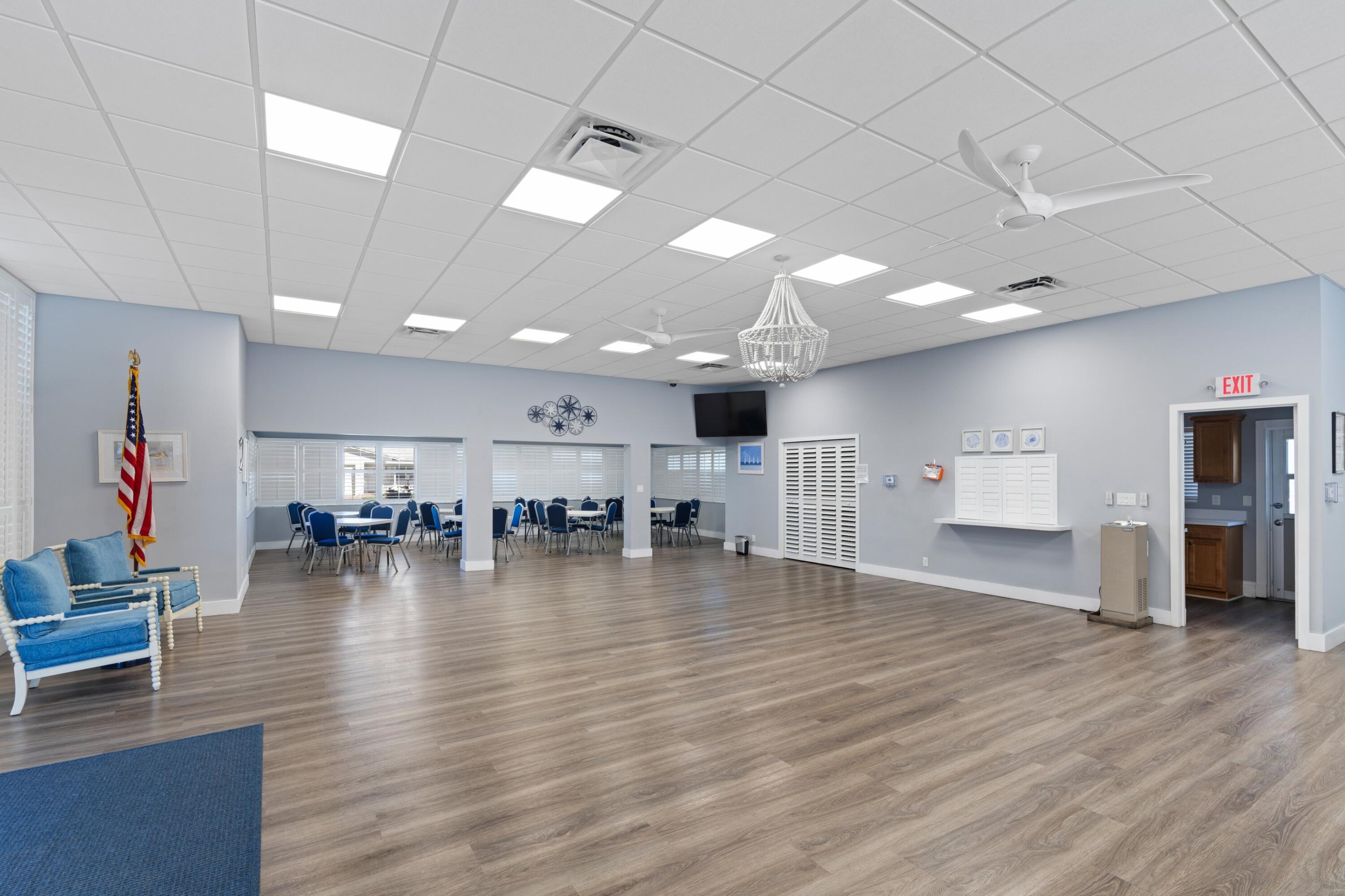 816 Southwest 18th Court Boynton Beach, FL 33426 - Photo 29 of 37 a view of empty room with wooden floor and furniture