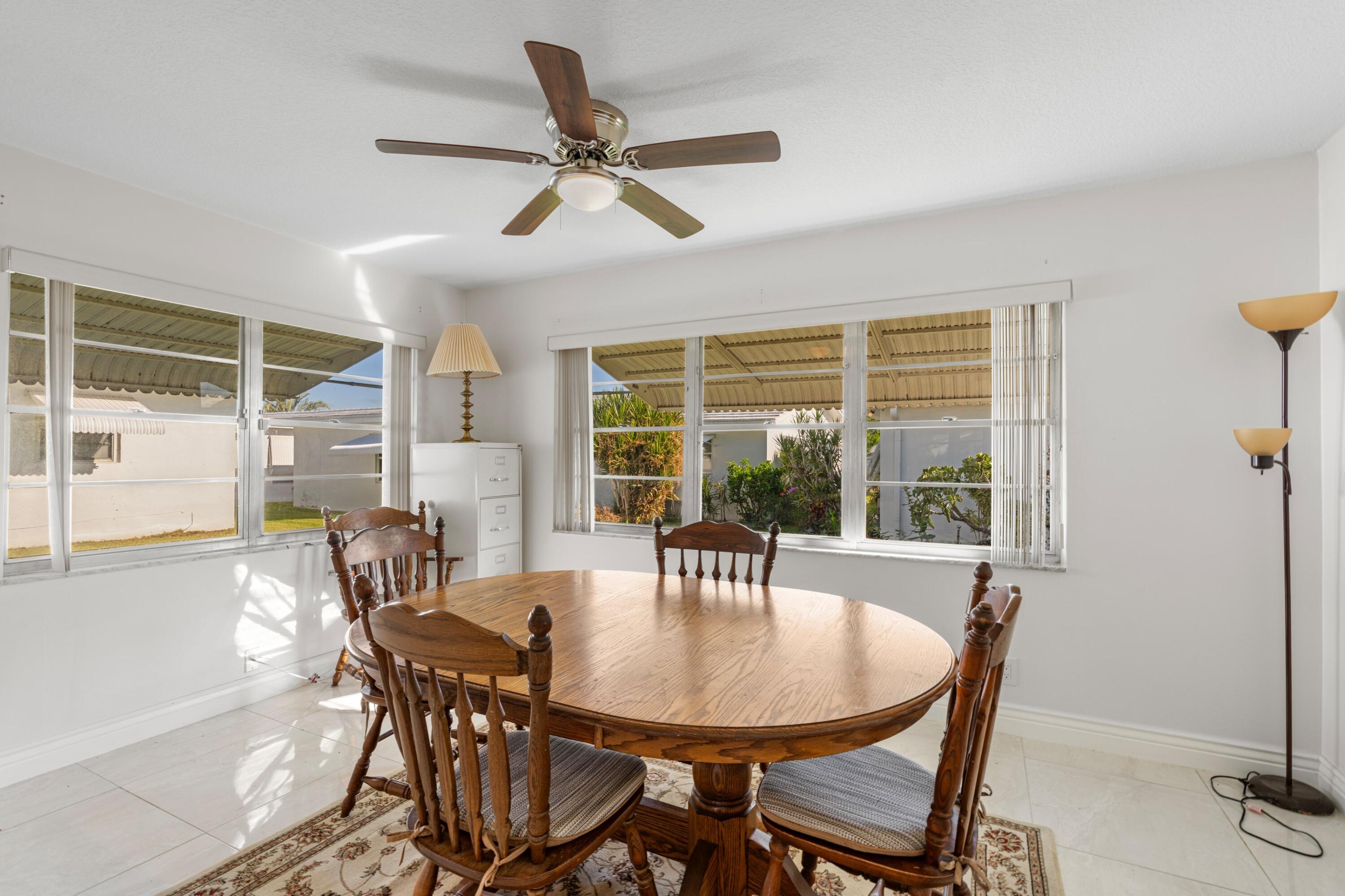 816 Southwest 18th Court Boynton Beach, FL 33426 - Photo 8 of 37 a view of a dining room with furniture window and outside view